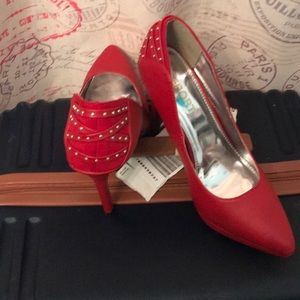 Sexy red 4” heels with strappy studded back.